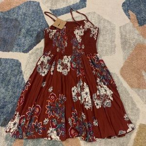 Stretchy top of dress with a line skirt. Maroon with florals. Size small